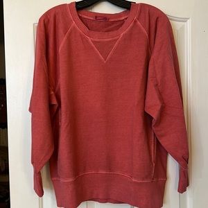 Red/salmon colored sweatshirt